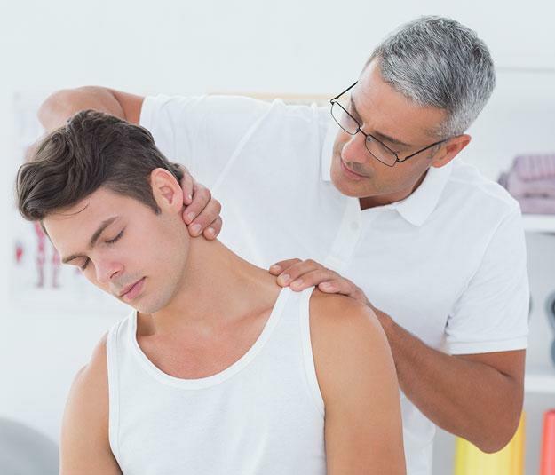Man with shoulder pain and stiff neck sees chiropractor in knoxville for treatment