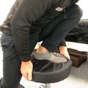 Runner's Knee treatment using chair calf stretch