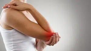 Female golfer having elbow pain