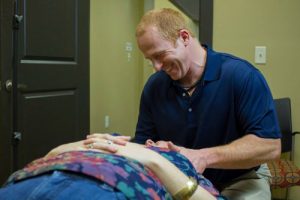 Dr. Bert is our chiropractor and he is giving an upper cervical chiropractic adjustment