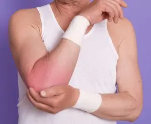 a man having pain in the elbow due to sports