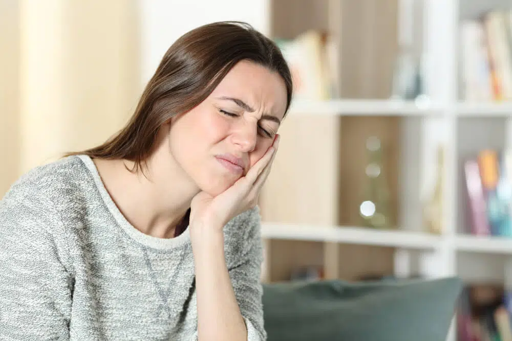 Patient suffering form severe pain cause of TMJ disorder