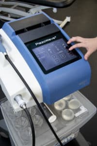 Close up view of the shockwave therapy machine