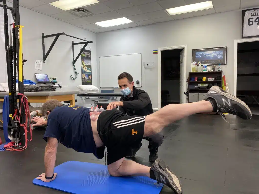 man assisted by therapist during session for Creative Paths to an Active Lifestyle