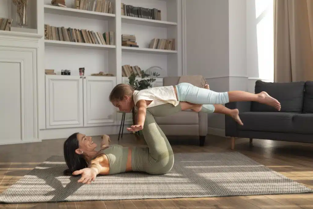 mother and a child doing yoga - Physical Therapy and Chiropractic Care