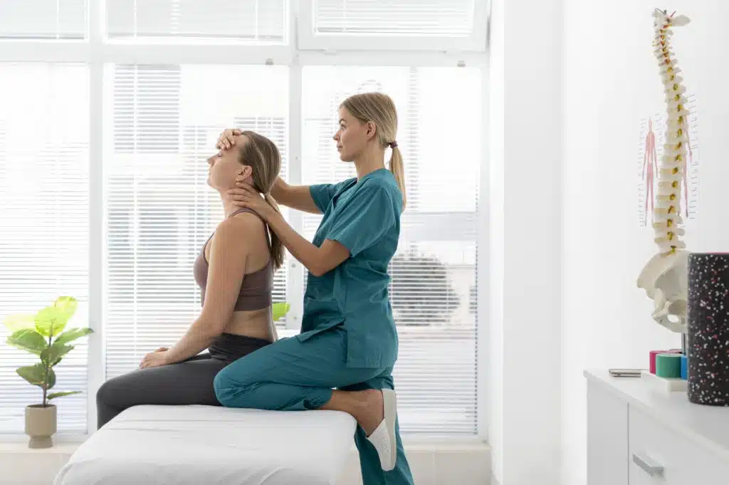 physiotherapist helping patient to have a good body posture